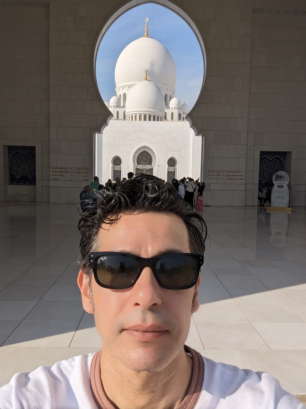 One of Sheikh Zayed Grand Mosque's white marble domes, framed through an archway