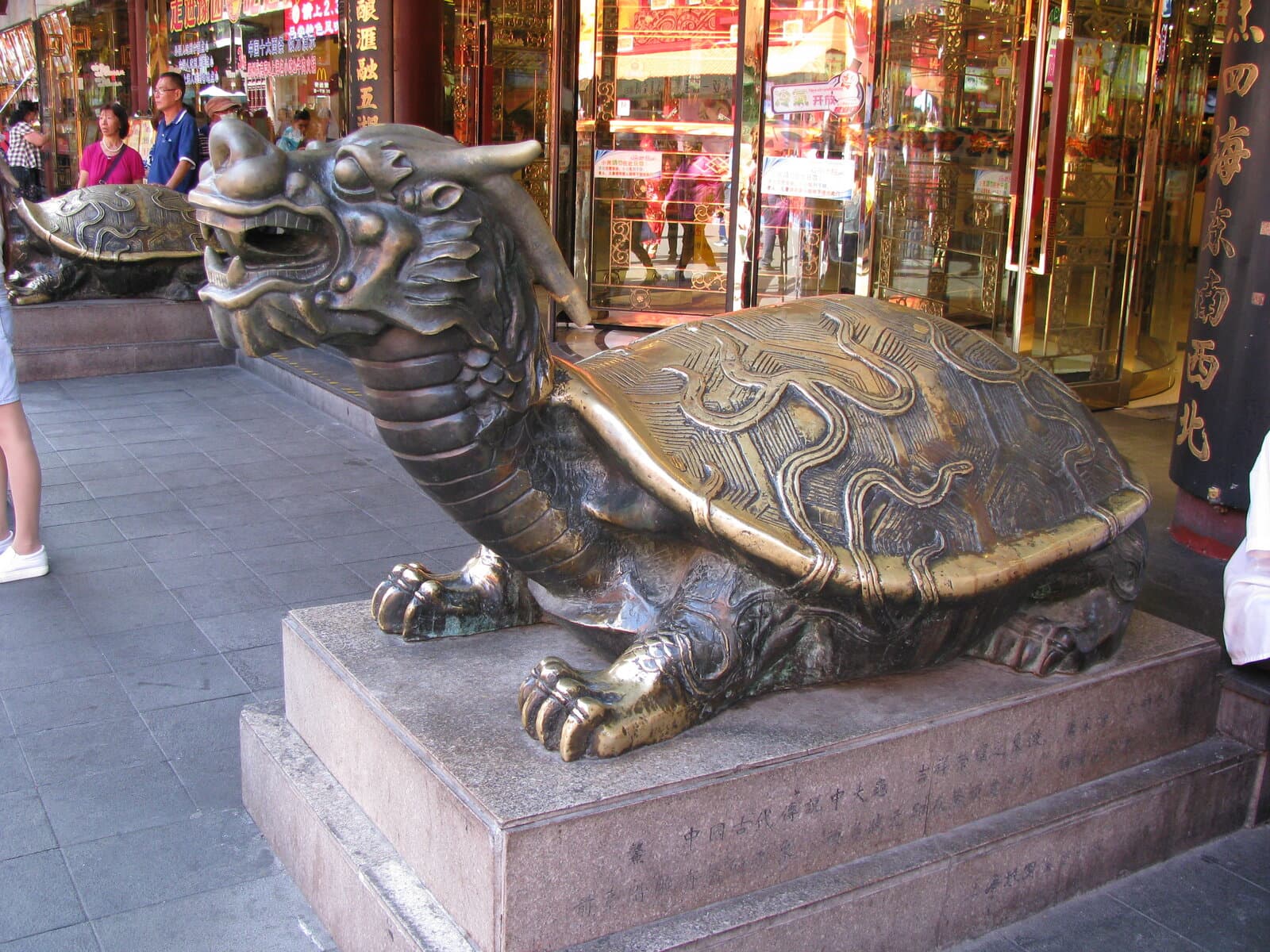 A bronze dragon-turtle statue at a Dragon Mart entrance in Dubai, a symbol of longevity in Chinese tradition