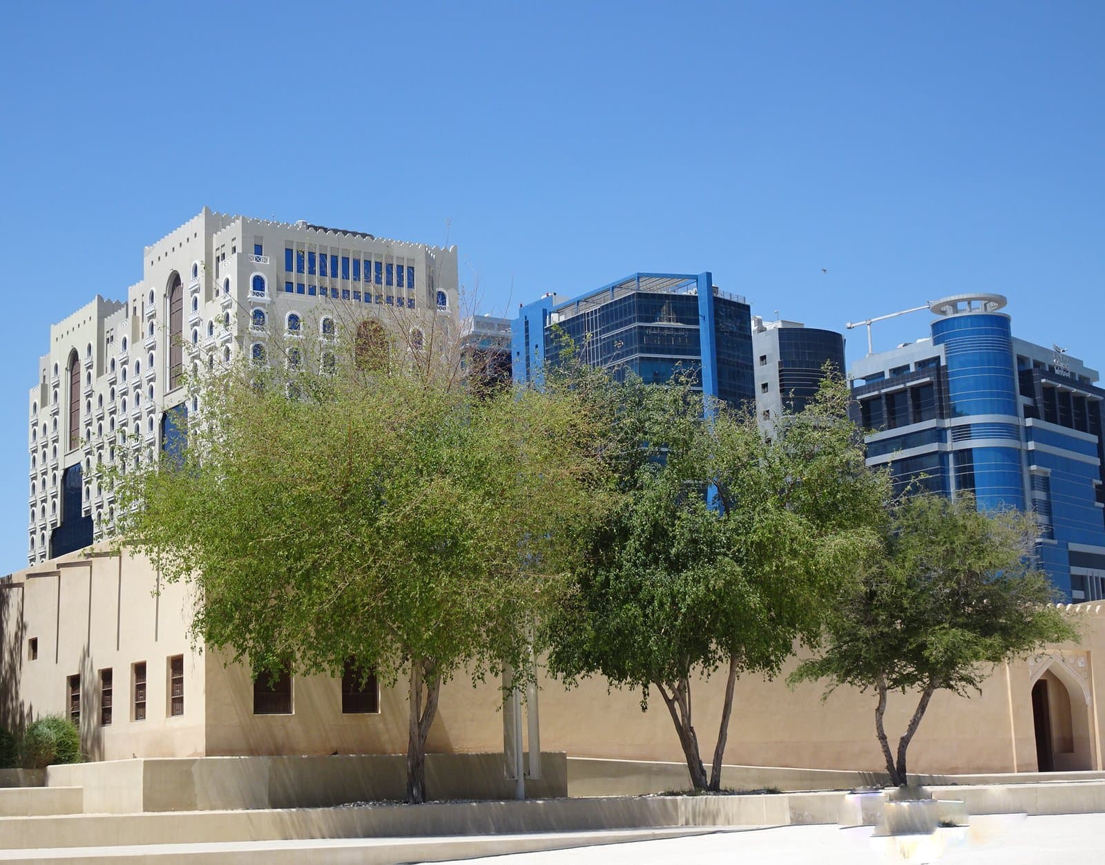 National Museum of Qatar building seen against the Doha skyline from the Old Salata district